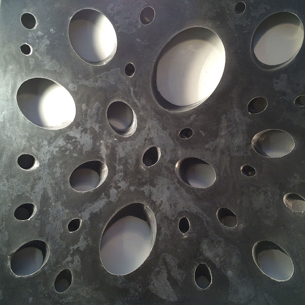 Conscious Forms - perforated concrete gfrc illuminated from the behind decorative wall panel